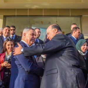 Group of people in conversation outdoors.